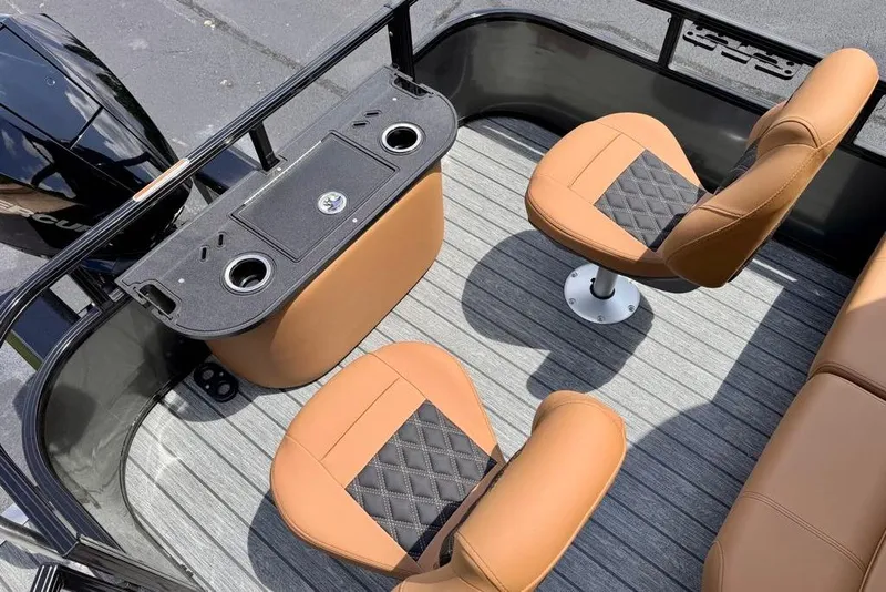 Slide: The Image of 2026 Ranger 223F boat interior with tan seats and modern console design. - 11