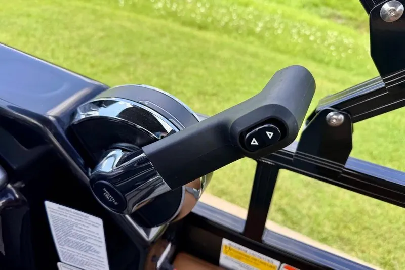 Slide: The Image of Throttle control lever of 2026 Ranger 223F boat, featuring sleek design and buttons. - 17