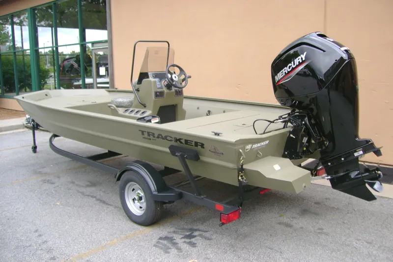 Slide: The Image of 2026 Tracker Grizzly 1860 CC boat with Mercury outboard motor on trailer. - 5