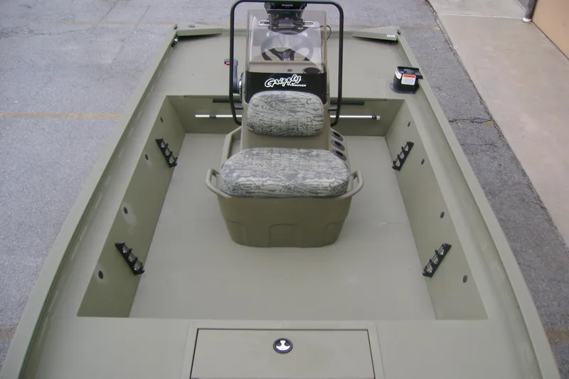 Slide: The Image of 2026 Tracker Grizzly 1860 CC boat interior with camouflage seating and spacious layout. - 9