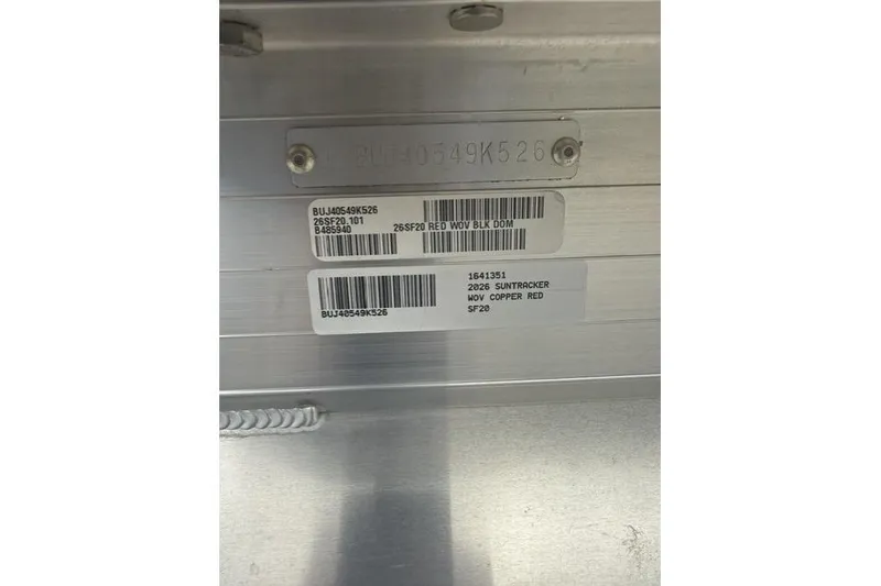 Slide: The Image of 2026 Sun Tracker SportFish 20 DLX identification plate with serial numbers and model details. - 10