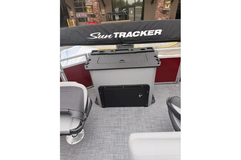 Slide: The Image of 2026 Sun Tracker SportFish 20 DLX boat interior with seating and storage area. - 8