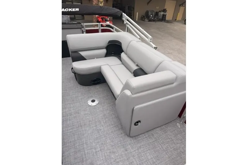 Slide: The Image of 2026 Sun Tracker SportFish 20 DLX pontoon boat with gray seating and spacious deck. - 9