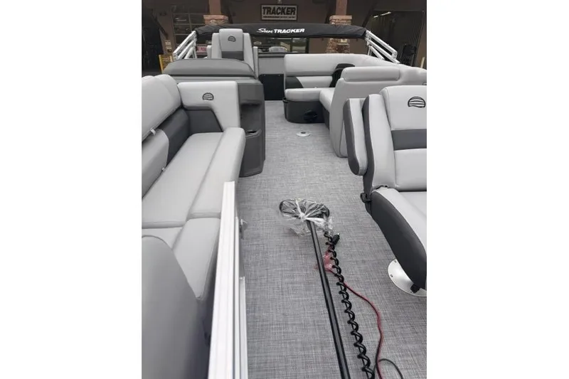 Slide: The Image of 2026 Sun Tracker SportFish 20 DLX interior with gray seating and modern design. - 7