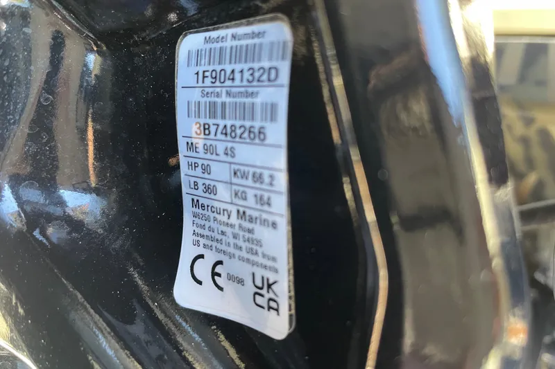 Slide: The Image of Label on Tracker Grizzly 1860 CC, 2026 model, showing serial and model numbers. - 77