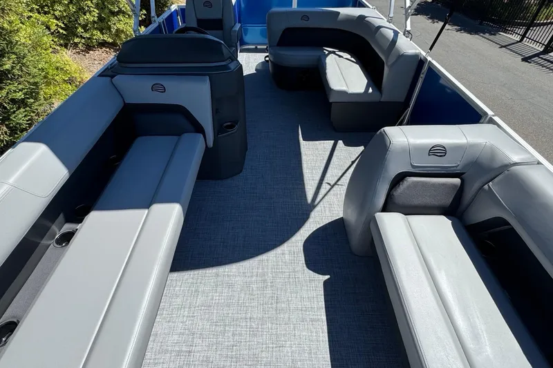 Slide: The Image of 2026 Sun Tracker Party Barge 18 DLX interior with spacious seating and modern design. - 18