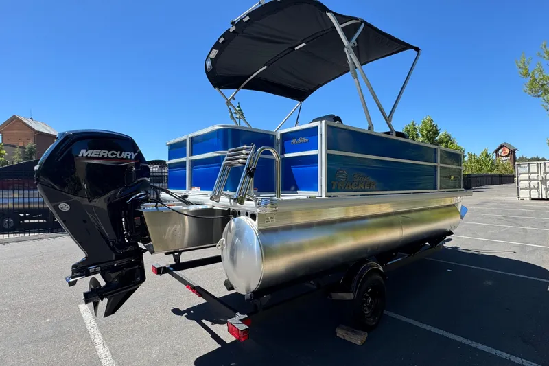 Slide: The Image of 2026 Sun Tracker Party Barge 18 DLX pontoon boat with Mercury outboard motor. - 7