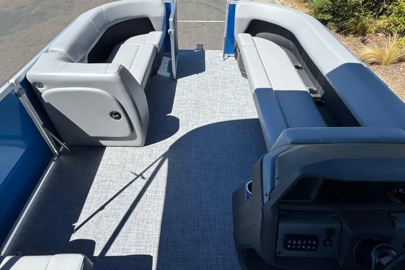 Slide: The Image of 2026 Sun Tracker Party Barge 18 DLX interior with spacious seating and modern design. - 16