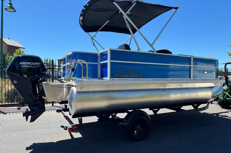 Slide: The Image of 2026 Sun Tracker Party Barge 18 DLX pontoon boat with Mercury outboard motor. - 10