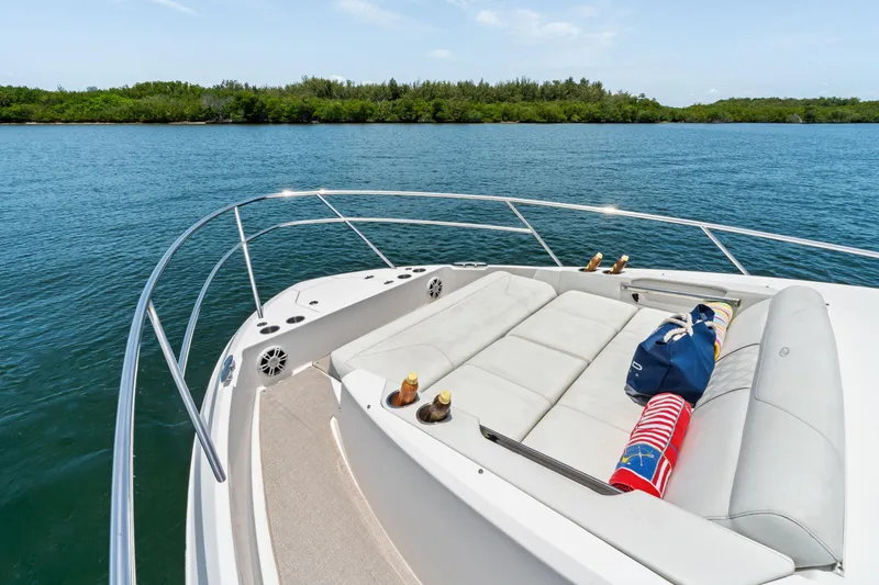 Slide: The Image of Luxurious 2022 Regal boat with spacious deck, scenic water view, and comfortable seating. - 4