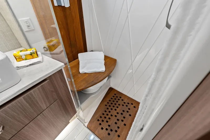 Slide: The Image of Modern 2022 Regal bathroom with wooden accents and sleek design elements. - 28
