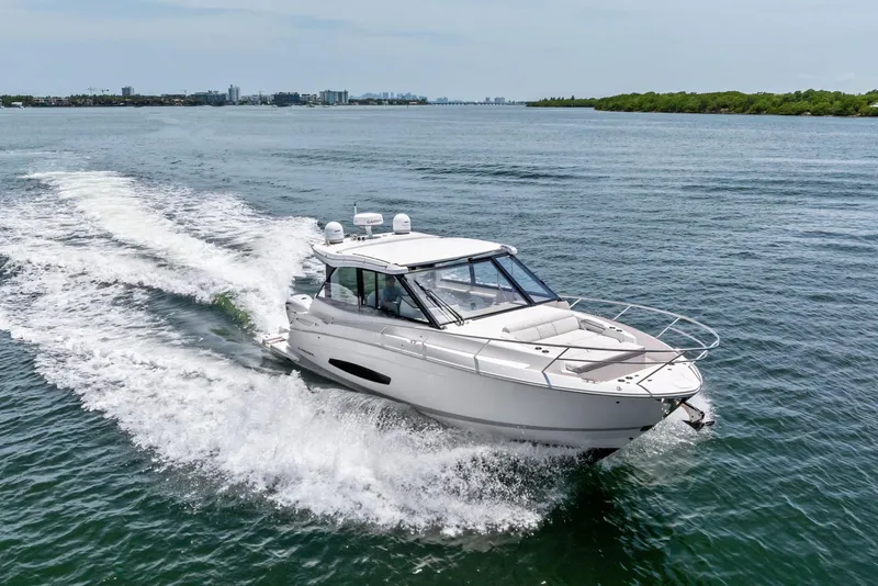 Slide: The Image of 2022 Regal boat cruising on open water, showcasing sleek design and performance. - 3