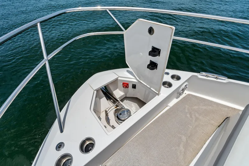 Slide: The Image of Bow area of a 2022 Regal boat with anchor storage and railing. - 6