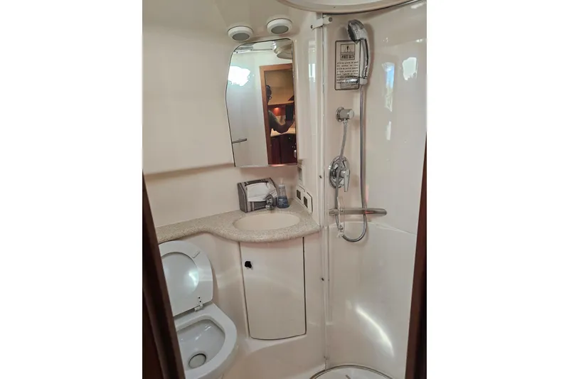 Slide: The Image of Bathroom interior of 2003 Tiara Yachts 3800 Open, featuring shower and toilet. - 9