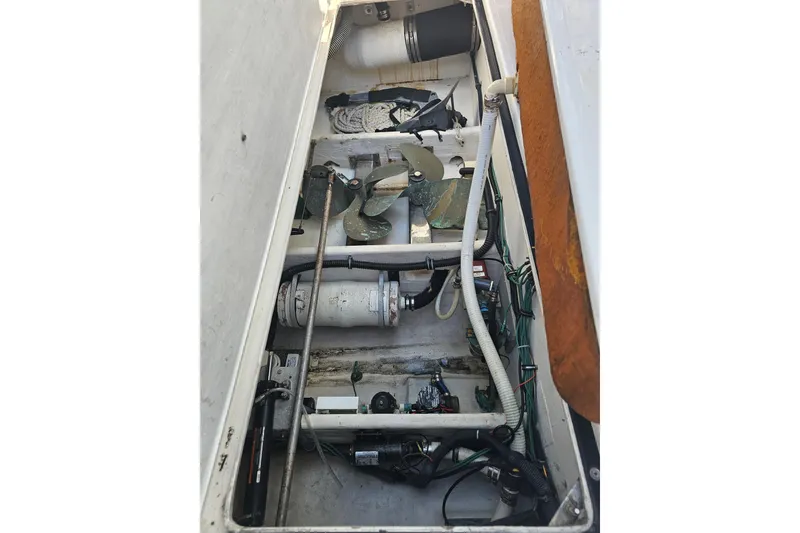 Slide: The Image of Engine compartment of a 2003 Tiara Yachts 3800 Open, showing mechanical components and wiring. - 13