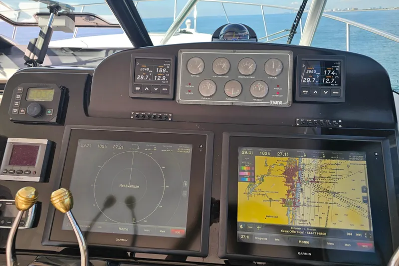 Slide: The Image of Tiara Yachts 2003 3800 Open dashboard with navigation and control displays. - 6