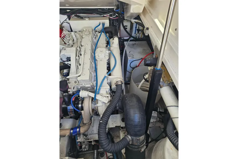 Slide: The Image of Engine compartment of a 2003 Tiara Yachts 3800 Open, showcasing mechanical components. - 16