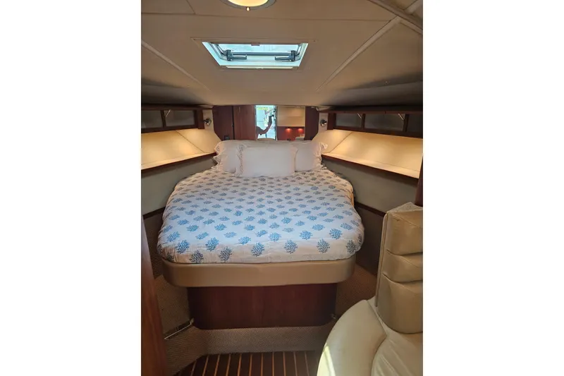 Slide: The Image of Luxurious cabin interior of 2003 Tiara Yachts 3800 Open with cozy bedding. - 10