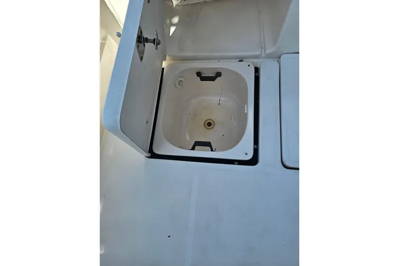 Slide: The Image of Open storage compartment on 2003 Tiara Yachts 3800 Open deck. - 12