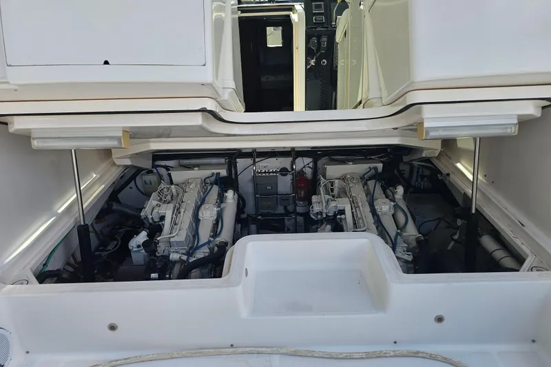 Slide: The Image of Engine compartment of a 2003 Tiara Yachts 3800 Open, showcasing dual engines. - 17