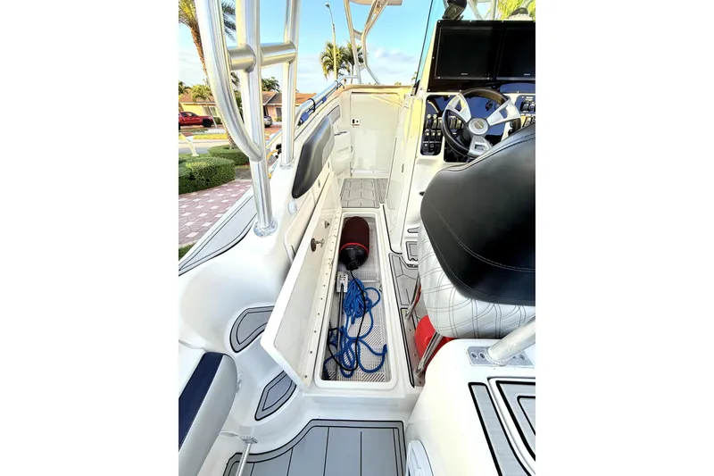 Slide: The Image of 2005 Hydra-Sports 3300 VX boat interior with steering wheel and storage compartment. - 15