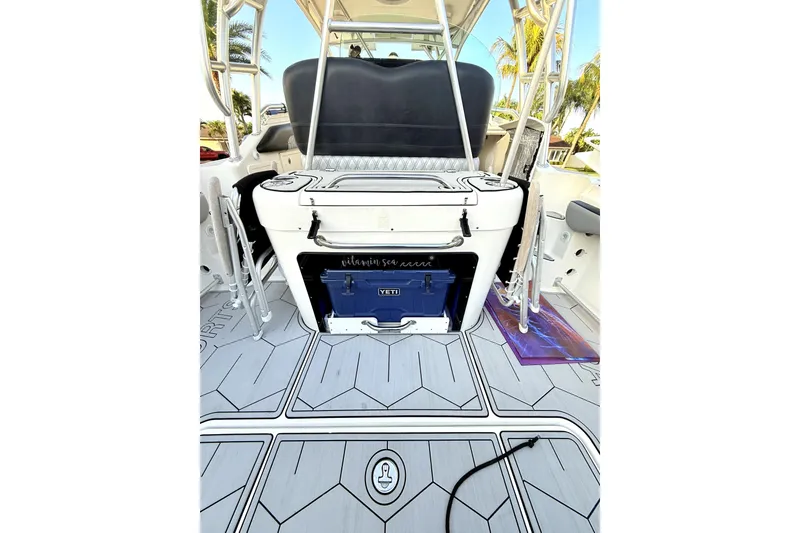 Slide: The Image of 2005 Hydra-Sports 3300 VX boat interior with YETI cooler and fishing gear. - 18