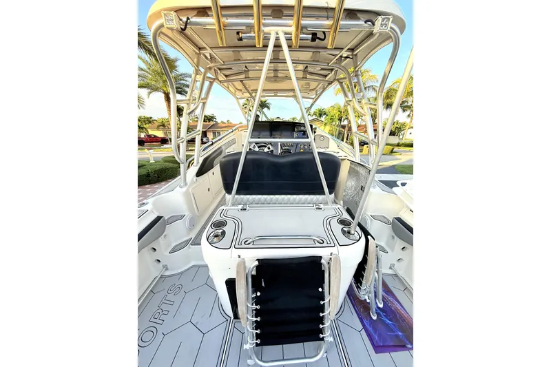 Slide: The Image of 2005 Hydra-Sports 3300 VX boat interior with seating and helm, showcasing sleek design. - 10