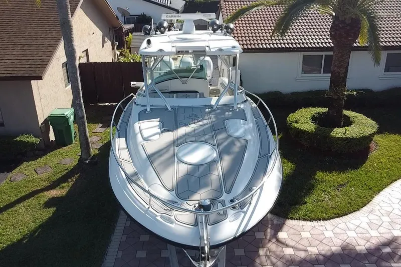 Slide: The Image of 2005 Hydra-Sports 3300 VX boat parked in a residential driveway, aerial view. - 6