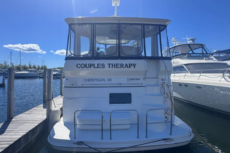 Slide: The Image of 2004 Carver 466 Motor Yacht named "Couples Therapy" docked in Cheboygan, MI marina. - 3