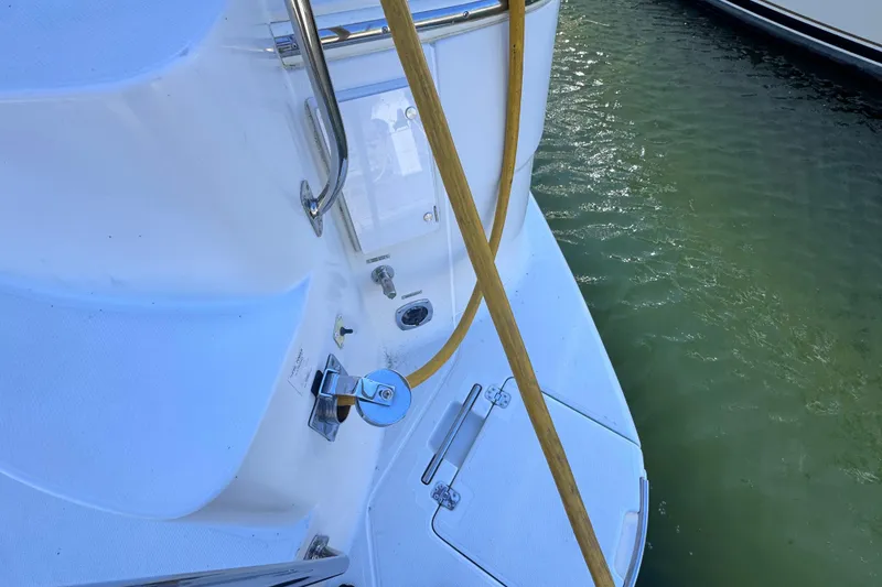 Slide: The Image of 2004 Carver 466 Motor Yacht deck with hose and water access. - 47