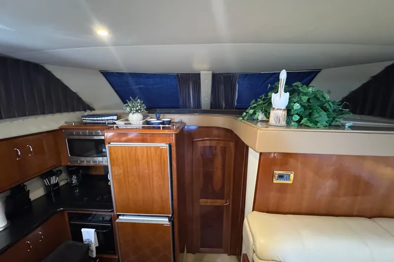 Slide: The Image of Interior of 2004 Carver 466 Motor Yacht with kitchen and decorative elements. - 17