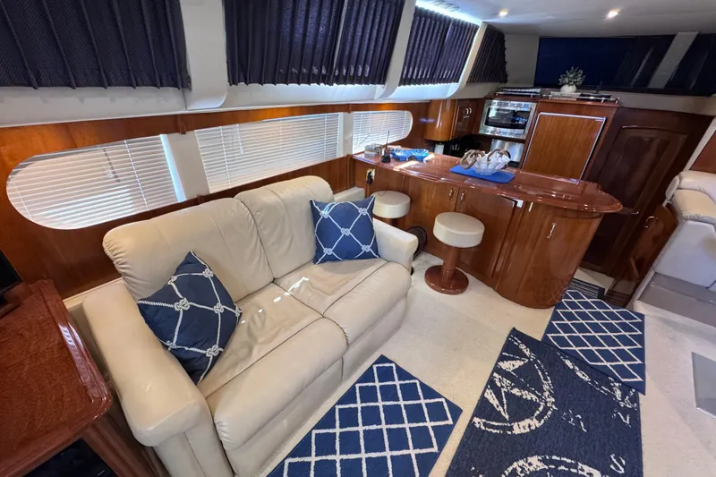 Slide: The Image of Luxurious interior of 2004 Carver 466 Motor Yacht with plush seating and elegant wood finishes. - 15
