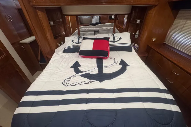 Slide: The Image of Nautical-themed bedroom in 2004 Carver 466 Motor Yacht with anchor bedding. - 27