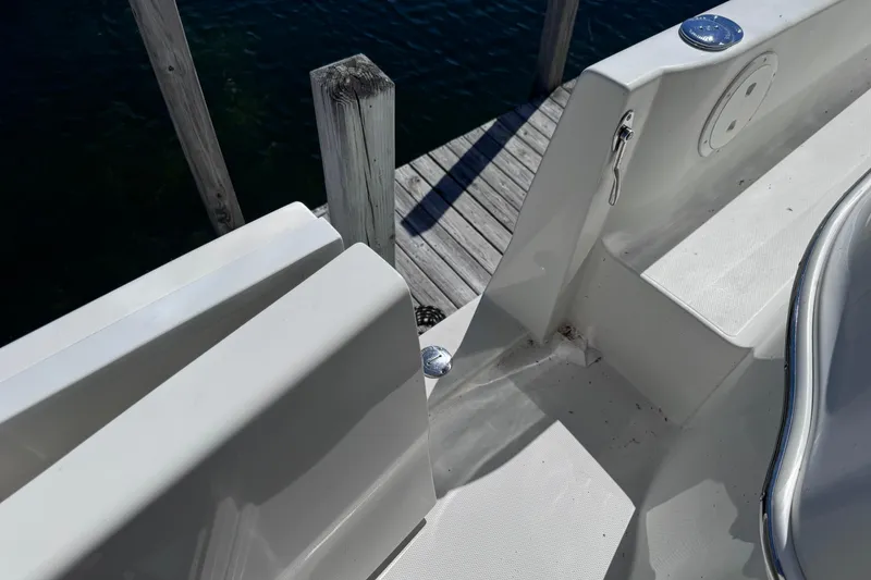 Slide: The Image of 2004 Carver 466 Motor Yacht deck detail near dock, showcasing clean design. - 44