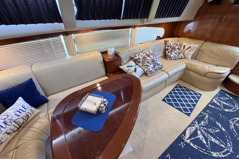 Slide: The Image of Luxurious interior of 2004 Carver 466 Motor Yacht with plush seating and decorative pillows. - 18