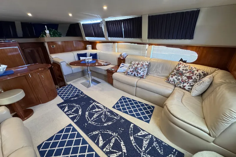 Slide: The Image of Luxurious interior of 2004 Carver 466 Motor Yacht with plush seating and elegant decor. - 14