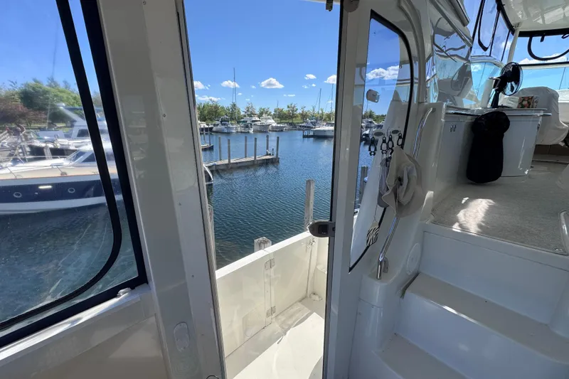 Slide: The Image of Interior view of 2004 Carver 466 Motor Yacht overlooking marina with boats. - 37