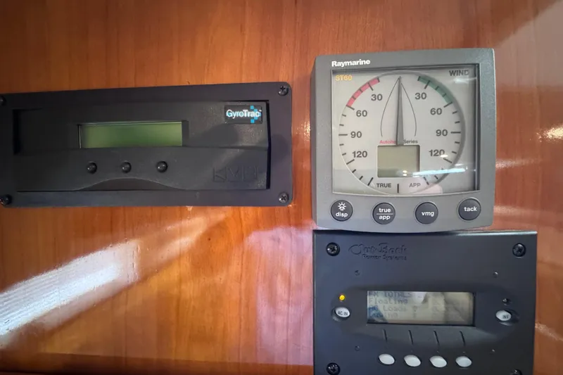 Slide: The Image of Control panel of a 2004 Carver 466 Motor Yacht with navigation instruments. - 21