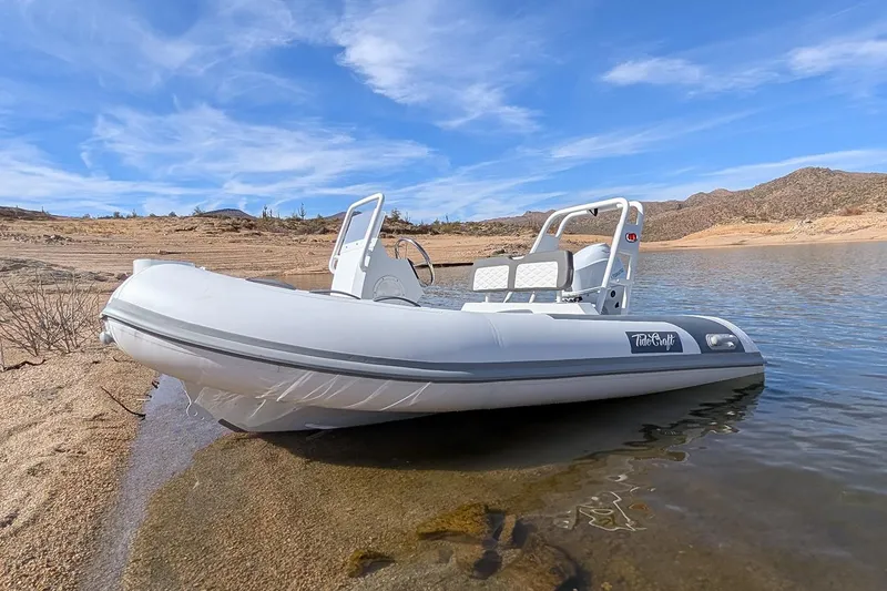 The Image of Manufacturer Provided Image: 2025 Tide Craft Beaver 10 boat on a serene lake with clear blue skies. - 0