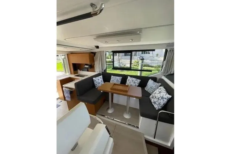 Slide: The Image of Interior of 2021 Beneteau Swift Trawler 41 Fly with modern seating and dining area. - 4