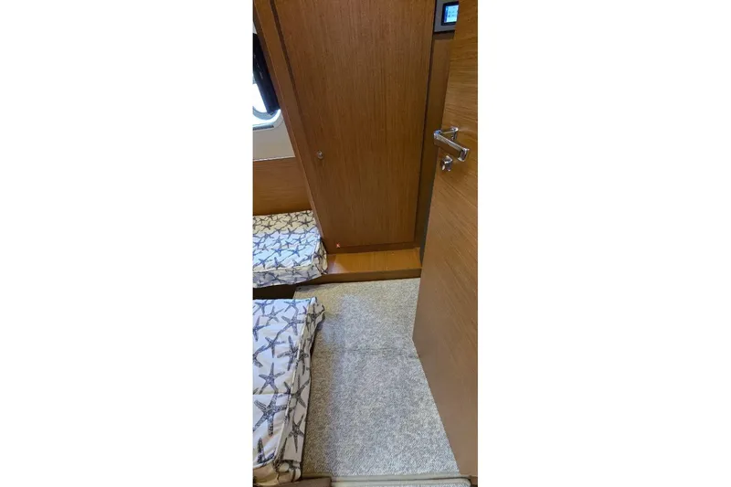 Slide: The Image of Interior cabin view of 2021 Beneteau Swift Trawler 41 Fly with wooden finish. - 14