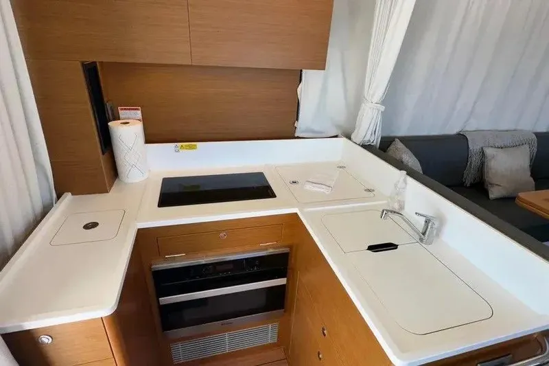 Slide: The Image of Modern kitchen area in a 2021 Beneteau Swift Trawler 41 Fly yacht. - 3