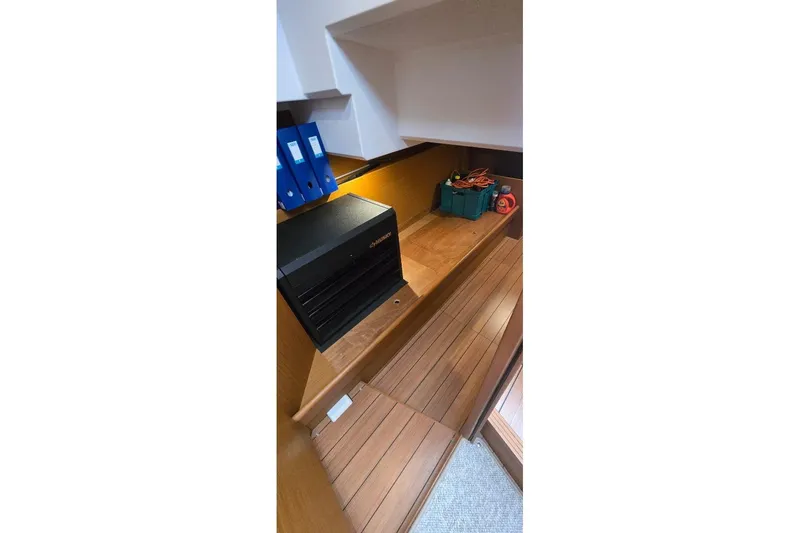Slide: The Image of Interior of 2021 Beneteau Swift Trawler 41 Fly with storage and equipment. - 8