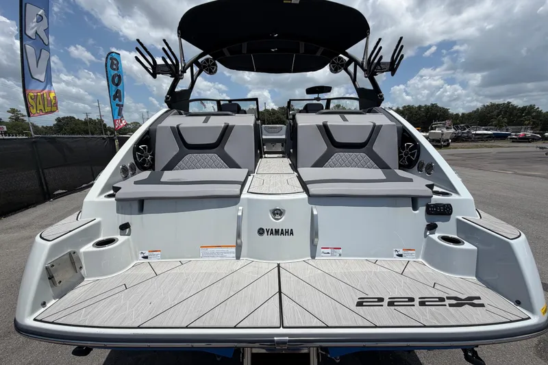 Slide: The Image of 2024 Yamaha Boats 222XD, rear view, showcasing sleek design and spacious seating. - 3