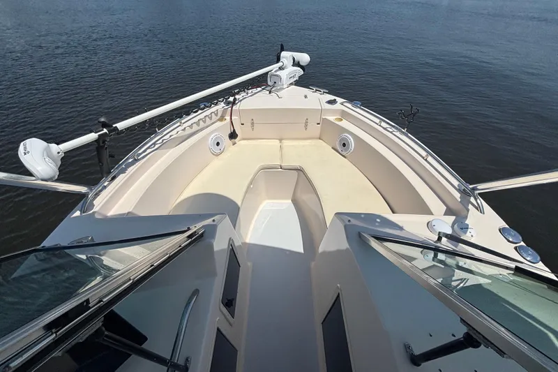 Slide: The Image of Bow view of 1999 Grady-White Tournament 225 boat on calm water. - 14