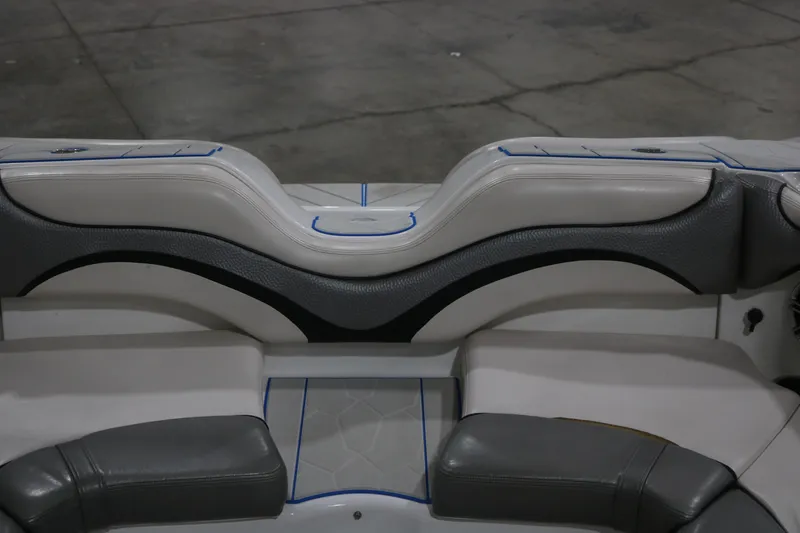 Slide: The Image of 2009 Yamaha Boats 212X interior seating with gray and white upholstery. - 28