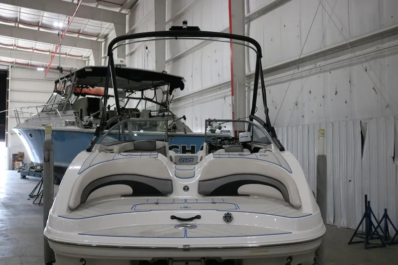 Slide: The Image of 2009 Yamaha Boats 212X in a warehouse, showcasing sleek design and modern features. - 3