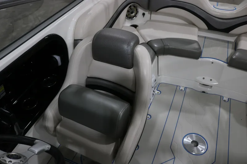 Slide: The Image of Interior of a 2009 Yamaha Boats 212X, featuring sleek seating and modern design elements. - 13