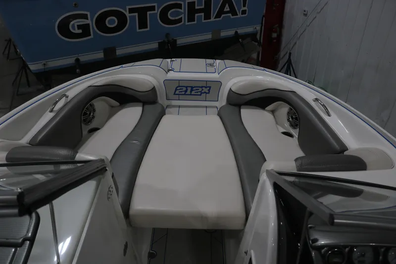 Slide: The Image of 2009 Yamaha Boats 212X interior with cushioned seating and speaker system. - 22