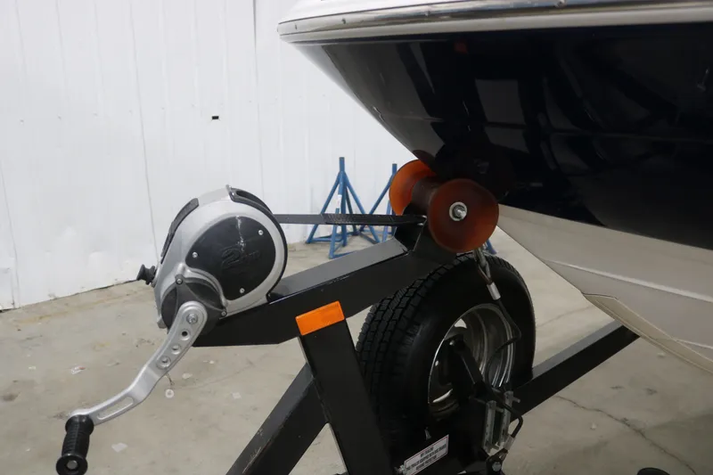 Slide: The Image of 2009 Yamaha Boats 212X on trailer with winch in garage setting. - 31